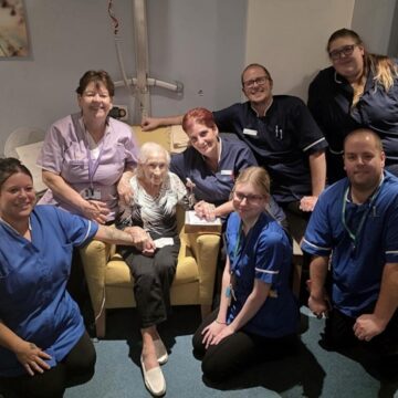 Picture of staff and Doris