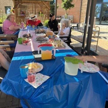 Picnic table is full of picnic food for our residents for world picnic day