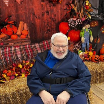 Picture of resident with autumnal background