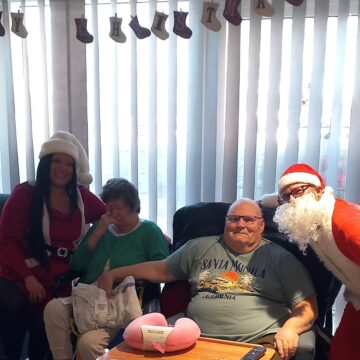 Family on Christmas Day with two staff members