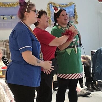 Staff singing Karaoke