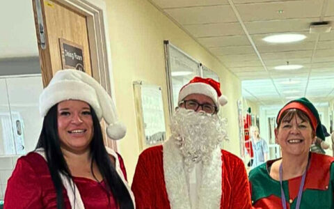 Picture of 3 members of staff Santa Claus Mrs Santa Claus and an Elf