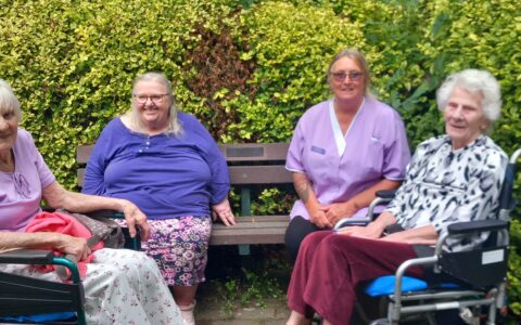 Group photo with 3 residents and Activities Coordinator