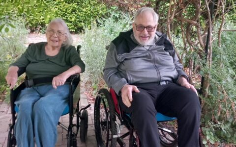 Two residents in wheelchairs at Trustlinks