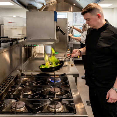 Sean our Head Chef cooking the lunch meal on the stove