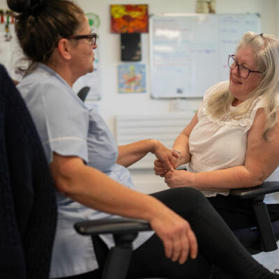 Service Manager talking with member of staff