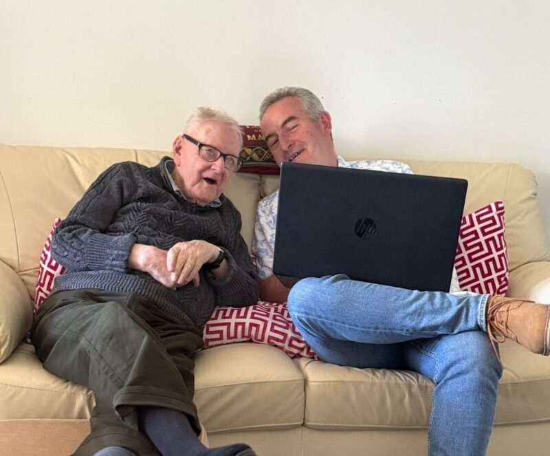 Peter and Thomas looking at laptop