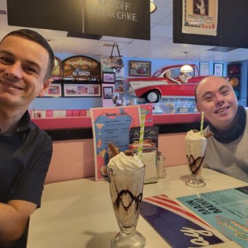 Service Users enjoying a chocolate and vanilla milkshake in an American diner