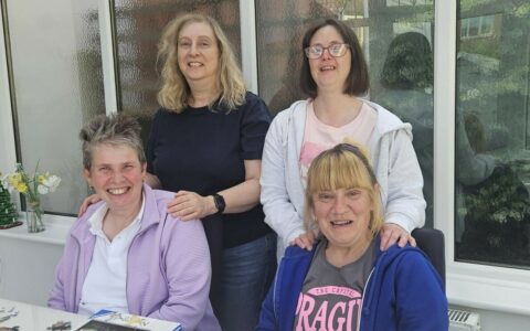 Picture of Natalie with 3 Service Users from Shared Lives