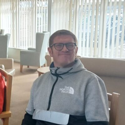 Picture of David sitting in a chair