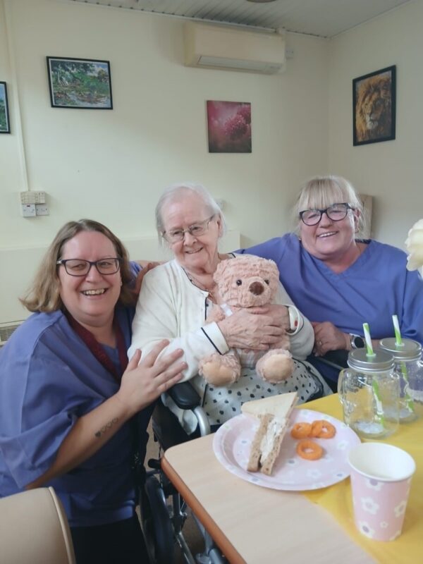 Betty with 2 members of staff and her teddy