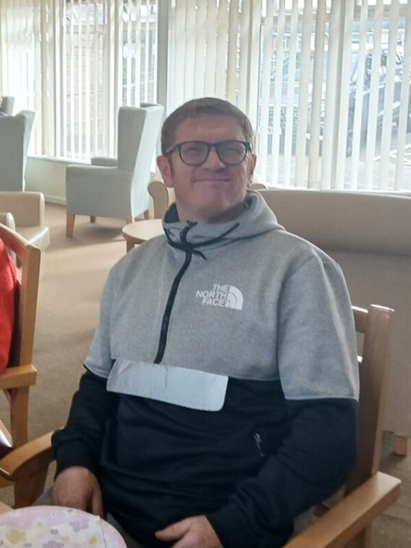 Picture of David sitting in a chair