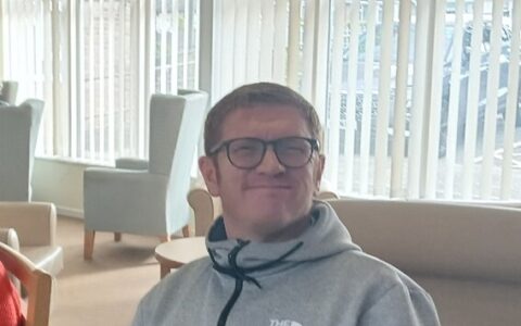 Picture of David sitting in a chair