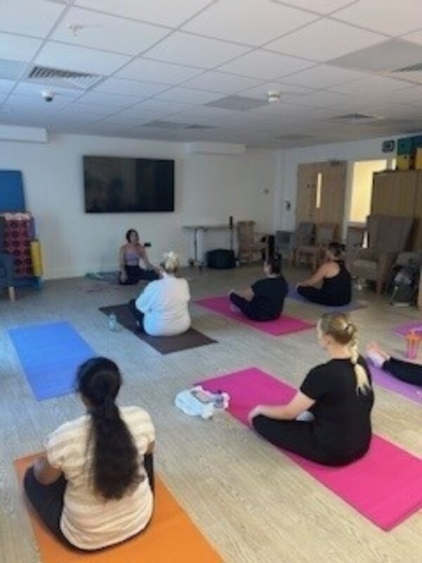 Staff doing a yoga class