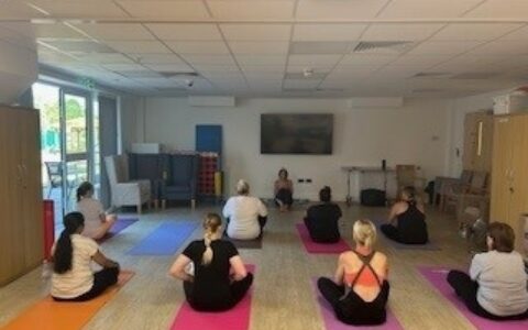 Staff doing a yoga class