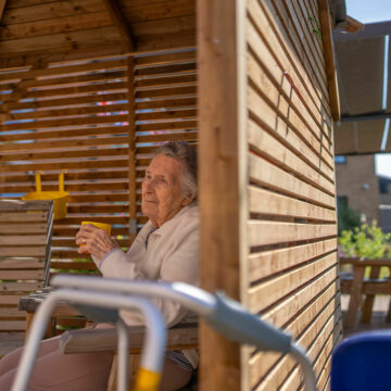 Our resident enjoying a cup of tea under our gazebo